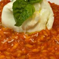 Risotto Caprese · San Marzano tomato sauce, Parmesan Cheese & fresh Basil.