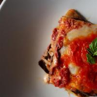Melanzane alla Parmigiana · Baked eggplant, in tomato sauce & mozzarella.