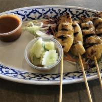 #6. Chicken Satay (on Skewers) · Grilled marinated chicken breast, served with peanut sauce and cucumber salad.