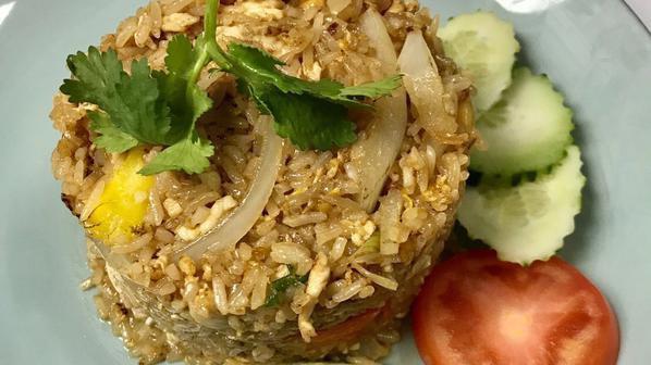 Pineapple Fried Rice · Pineapple, onion, scallions, cashew nuts and fried egg mixed with rice.