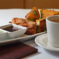 Bread Pakora with Tea · Deep fried chickpea flour batter bread fritters stuffing with mashed potatoes served with ch...
