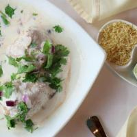Dahi Bhalla · Softly fried lentil dumplings topped with chilled yogurt, potato, onion, crispy wafers, and ...