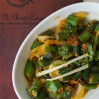 Masala Bhindi · Fresh okra tossed with onion, ginger, garlic, tomatoes, and special spices.