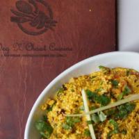 Paneer Bhurji · Cottage cheese cooked with ginger, garlic, tomato, peas, and traditional Indian spices.