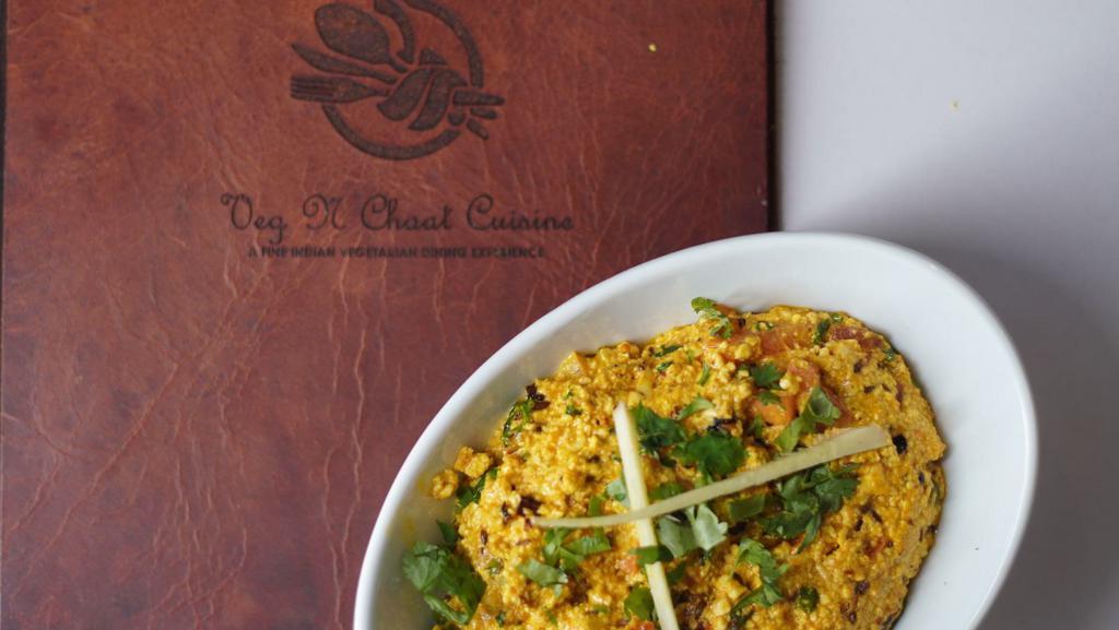 Paneer Bhurji · Cottage cheese cooked with ginger, garlic, tomato, peas, and traditional Indian spices.