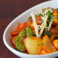 Chilli Paneer · Home made cheese cooked with bell pepper, ginger, garlic, onion, tomatoes in house special s...
