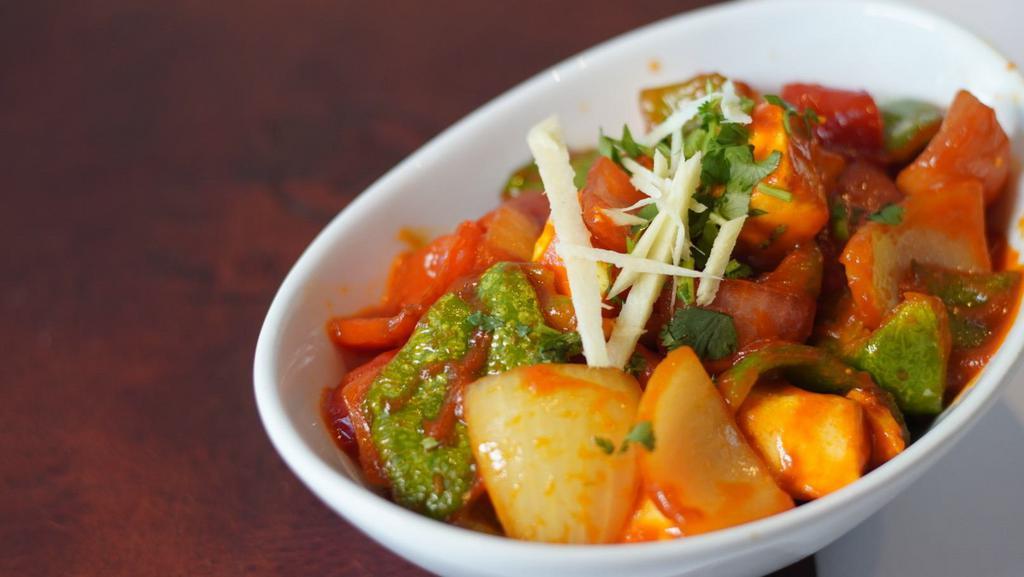 Chilli Paneer · Home made cheese cooked with bell pepper, ginger, garlic, onion, tomatoes in house special spices.