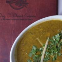 Spinach Dal · Yellow lentils cooked with fresh spinach and traditional Indian spices.