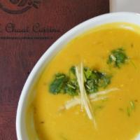 Toor Ki Dal · Yellow lentil soup cooked with curry leaves, dry whole red chilies in traditional Indian spi...