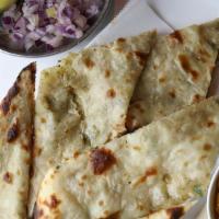 Plain Naan / Butter Naan · White flour bread baked in a charcoal fired clay oven.