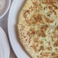 Paneer Paratha · Pan cooked whole wheat bread stuffed with homemade cheese, onions and special mixtures of sp...