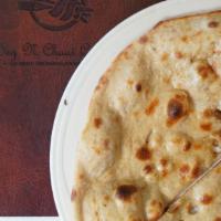 Tandoori Roti · Traditional whole wheat Indian bread made in clay oven.