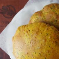 Methi Poori (2) · Puffed deep fried whole wheat bread with fenugreek.
