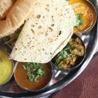 House Thali · Two vegetables, one plain paratha or two rotis, dal, rice, raita, home-style mint chutney,  ...