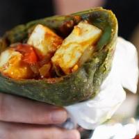 Chilli Paneer Wrap · Chilli paneer wrapped in plain paratha or spinach paratha served with chaas or soda.