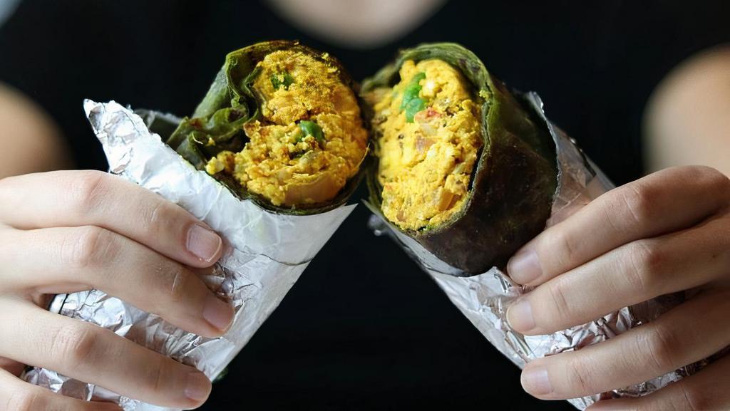 Paneer Bhurji Wrap · Fresh homemade mashed cheese cooked with spices, wrapped in plain paratha or spinach paratha served with chaas or soda.