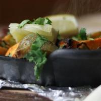 Tandoori Veggies Grill · Herbs marinated cauliflower, broccoli, bell pepper, onion, and cheese.