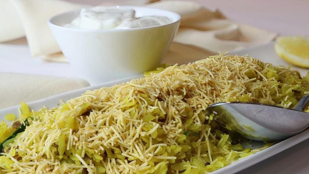 Kande Pohe · Soaked rice flakes sauteed with onions and spices.