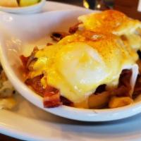 Eggs Blackstone · Bacon, tomatoes, mushrooms and two poached eggs on an english muffin, topped with hollandais...