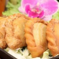 Curry Puffs · Thai Pastry with potato, yellow onion, garlic with curry powder, served with cucumber-plum s...