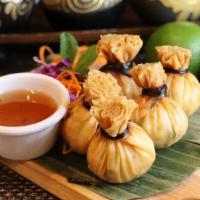 Golden Bags · Crispy wrappers stuffed with ground chicken, prawns, corn, onion, served plum sauce