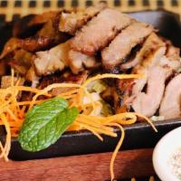 BBQ Pork · Marinated pork with Thai herbs, served with spicy scallion sauce