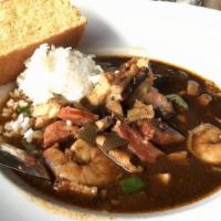 Chicken and Seafood Gumbo · shrimp, bacon, chicken, andouille sausage, okra, rice with house special sauce.