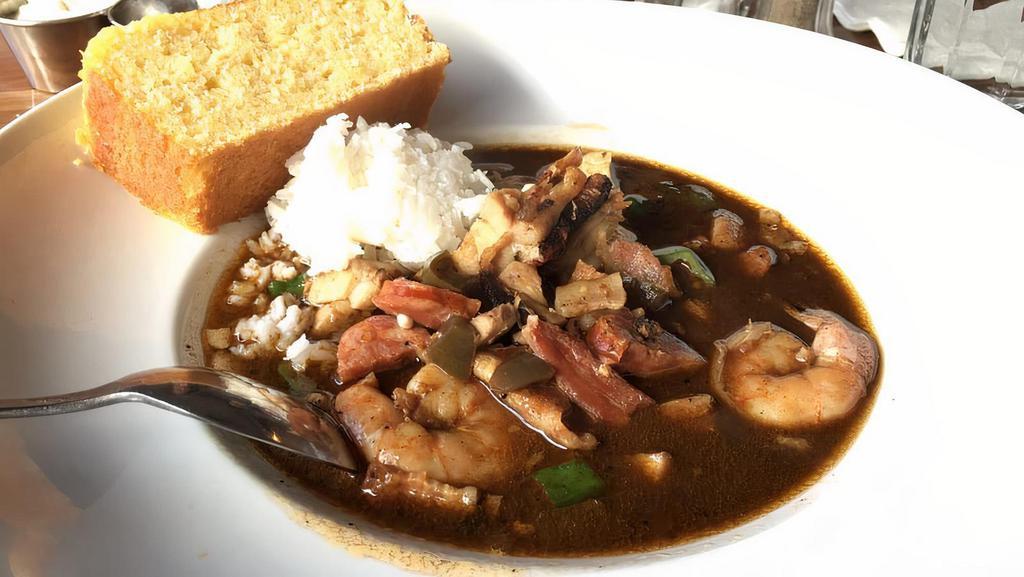 Chicken and Seafood Gumbo · shrimp, bacon, chicken, andouille sausage, okra, rice with house special sauce.
