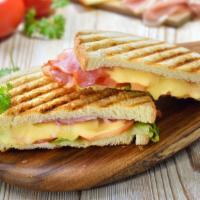 Ham and Cheese Sandwich · Sliced ham, sliced cheese, onions, lettuce, tomatoes, and mayo.