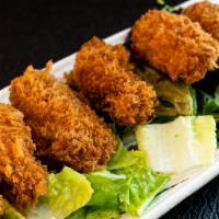 Fried Oysters · Six pieces Japanese style fried oyster with goma dressing.