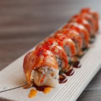 Giants Roll · Spicy scallop, cucumber, topped with fresh salmon, spicy mayo, unagi sauce and tobiko.