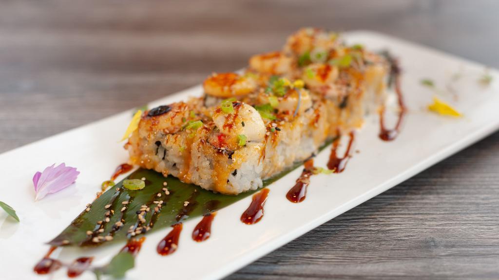 Baked Scallop Roll · Bake with crab meat avocado, scallop, topped with sesame seed, green onion, spicy mayo and unagi sauce.