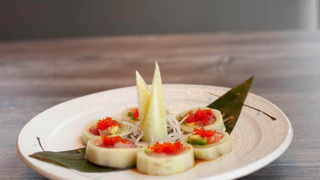 Sexy Lady Roll · Cucumber wrap with fresh salmon, tuna, hamachi jalapeño, topped with tobiko and ponzu sauce.
