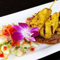 CHICKEN SATAY · Grill on skewers marinated chicken in spices and Thai curry powder, served with peanut sauce...