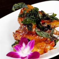 ANGEL WINGS · Fried chicken wings with sweet & sour garlic sauce top with crispy basil.