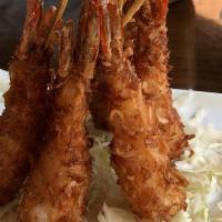 Coconut Prawn · Fried marinated prawn skewers batter in coconut meat and flour. Served with house sweet and ...