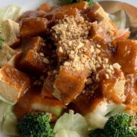 Praram Tofu · Steam veggie, fried tofu, and top with Thai peanut curry sauce.
