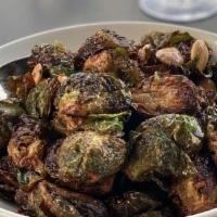 Crispy Brussels Sprouts · An Honor favorite! savory onion caramel, lime, mint, roasted garlic, marcona almonds.