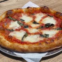Margherita · tomato, fresh heirlooms, stretched mozzarella, basil, parmesan