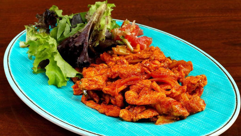 Doro Tibs · Chicken breast marinated and stir-fried with onion, tomato, garlic, and berbere. Add mushrooms and collard greens for an additional charge.