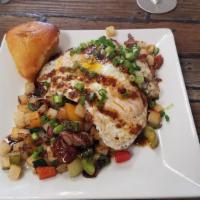Bacon Brisket Hash · Grilled potatoes, onions, peppers with bacon and brisket, topped with two eggs and maple Dij...