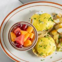 Eggs Benedict · Poached eggs on English muffin, Canadian bacon, topped with hollandaise sauce. also with a s...