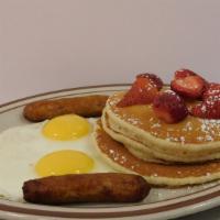 Any Fruit Pancake Combo · Choice of blueberry, strawberry or bananas, two eggs, two bacon strips or two sausage links.