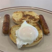 3. Min · One poached eggs English muffin, and a choice of two bacon strips or two sausage links.