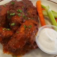 Chicken wings · 6 pieces ..Served with celery and carrots .ranch sauce