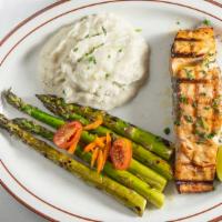 Salmon (8 oz) · 8  o z of grilled wild Alaskan fillet, served with grilled asparagus and mashed potatoes.