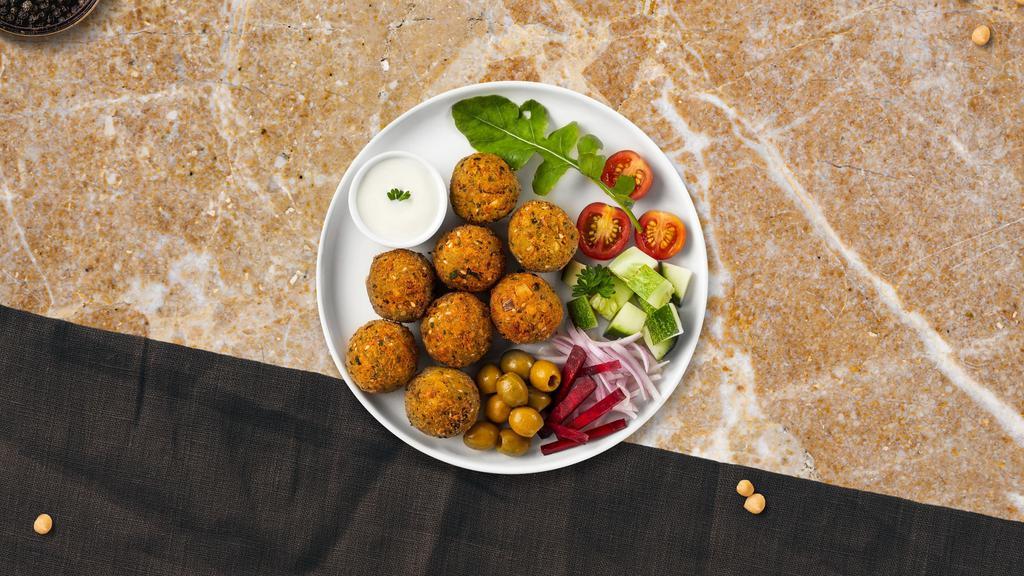 Falafel · Six pieces of crispy garbanzo beans marinated in homemade spices.