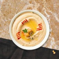 Hummus  · (8 oz.) Hearty mashed garbanzo bean dip served with warm pita bread.