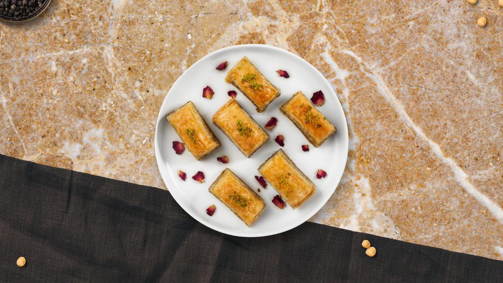 Pistachio Baklava · Two PCs traditional filo pastry with layers of chopped pistachio and sweet syrup.