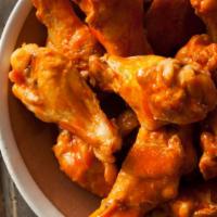Buffalo Wings · Fresh batch of wings smothered in a tangy, buffalo sauce and served with a side of ranch.